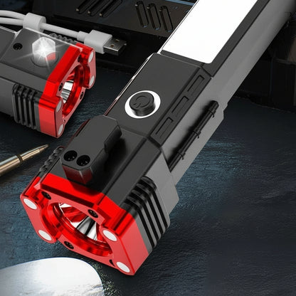 Multifunctional flashlight with red and black design on a dark surface